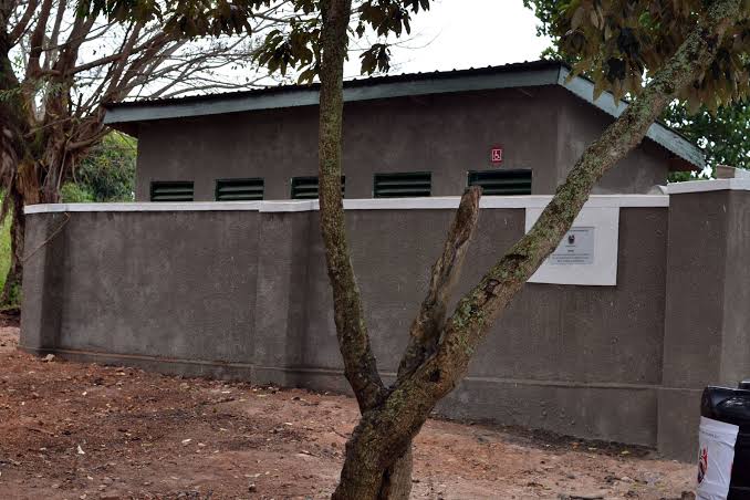 Toilet block with signage for accessible access.